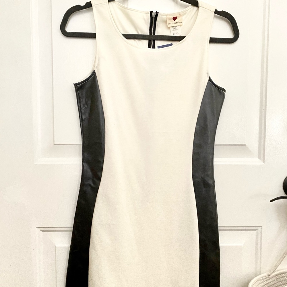 White dress with faux leather side.
